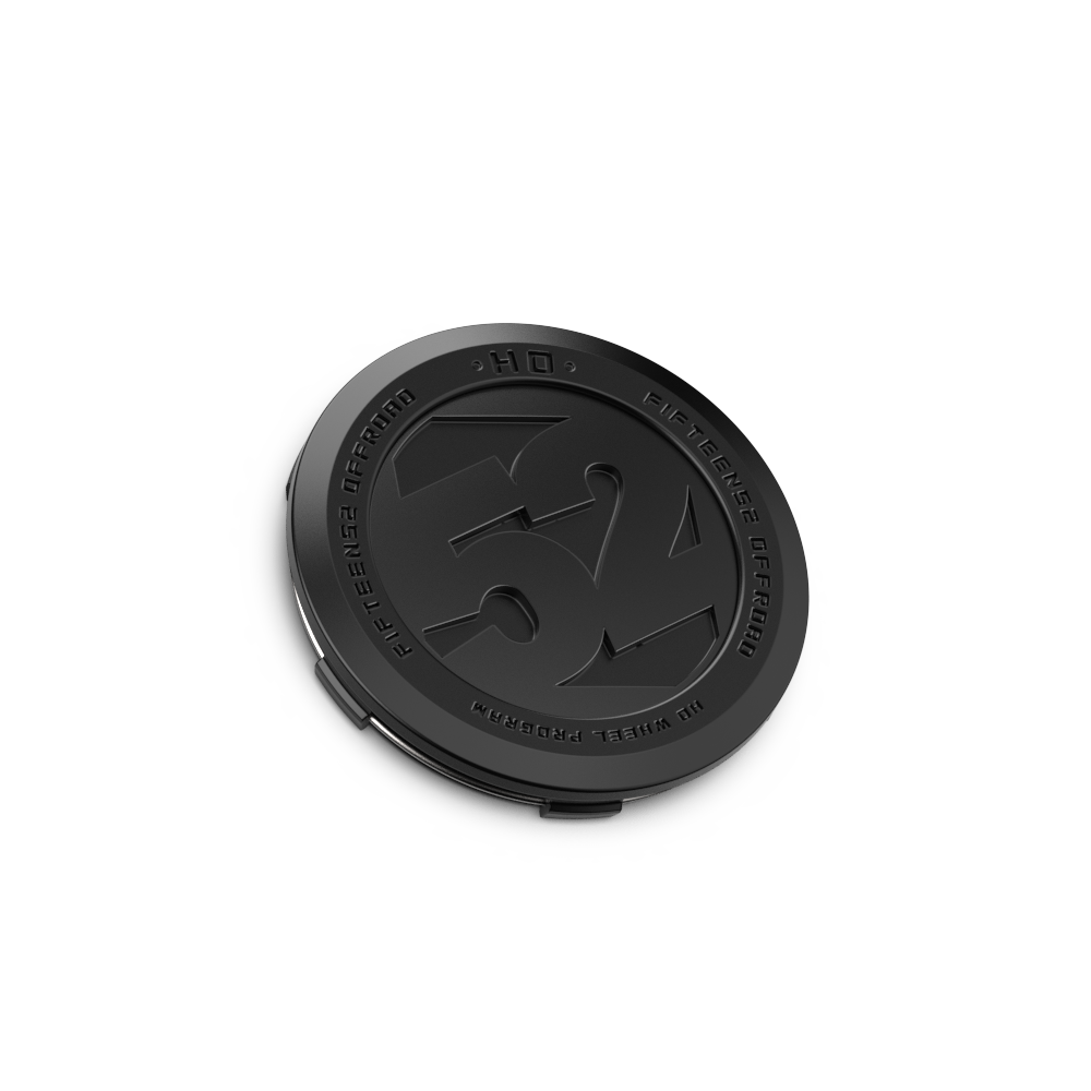 Black circular object with branding on a white background